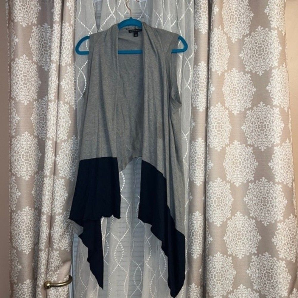 Gray and navy scarf-like sleeveless cardigan.